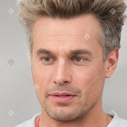 Neutral white adult male with short  brown hair and brown eyes