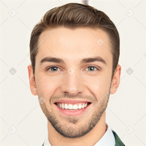 Joyful white young-adult male with short  brown hair and grey eyes