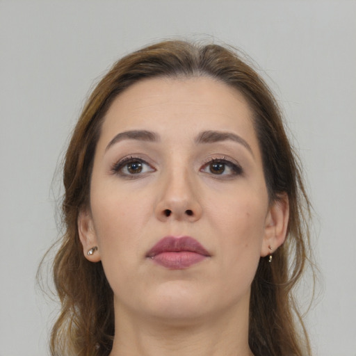 Neutral white young-adult female with medium  brown hair and brown eyes