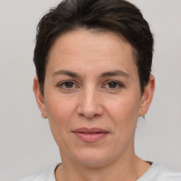 Joyful white adult female with short  brown hair and brown eyes