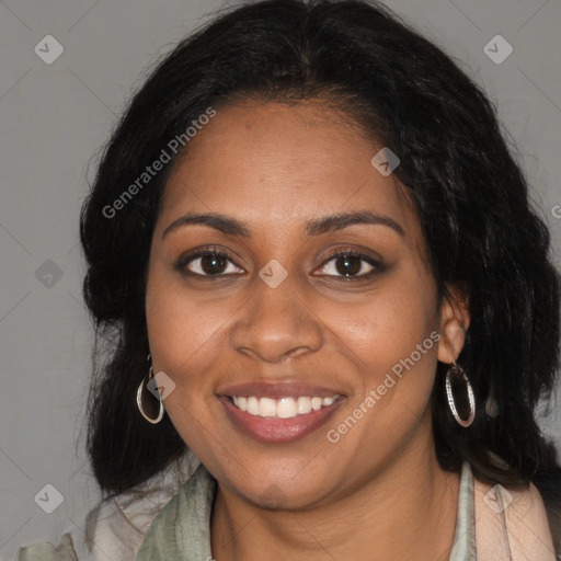 Joyful black young-adult female with long  brown hair and brown eyes