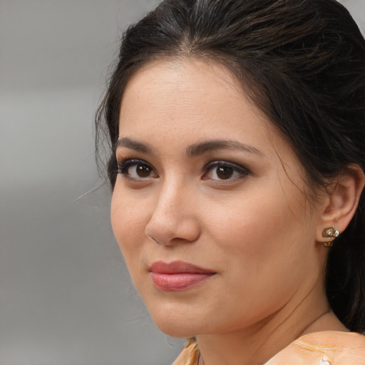 Joyful white young-adult female with medium  brown hair and brown eyes