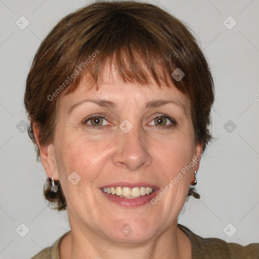 Joyful white adult female with medium  brown hair and grey eyes