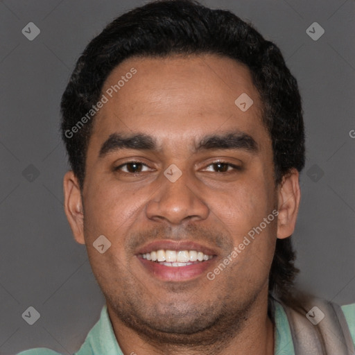 Joyful black young-adult male with short  brown hair and brown eyes