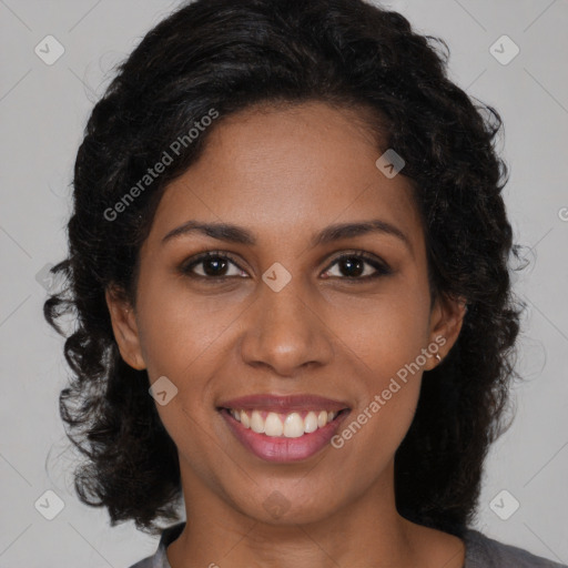 Joyful black young-adult female with medium  brown hair and brown eyes