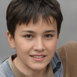 Joyful white child male with short  brown hair and brown eyes