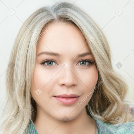 Joyful white young-adult female with long  brown hair and blue eyes