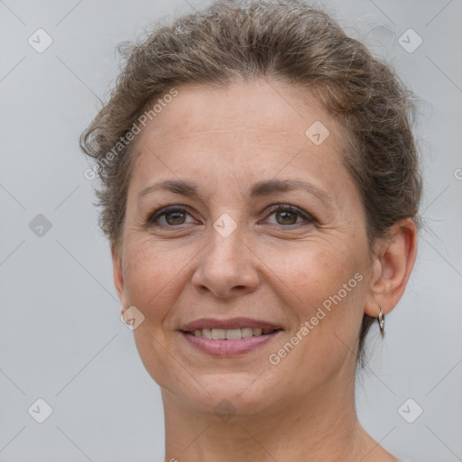 Joyful white adult female with short  brown hair and brown eyes