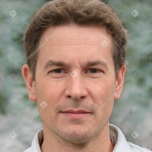 Joyful white adult male with short  brown hair and grey eyes