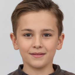 Joyful white child female with short  brown hair and brown eyes