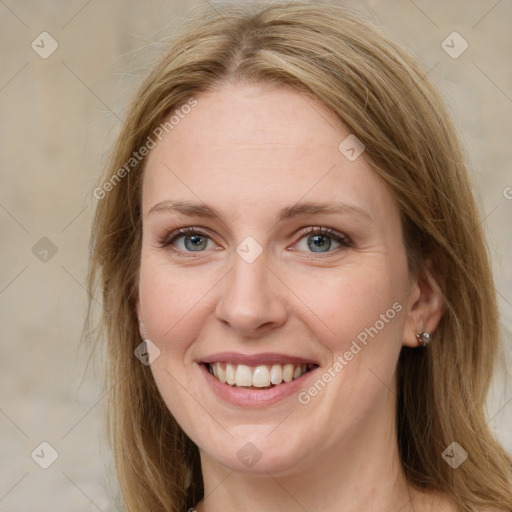 Joyful white young-adult female with long  brown hair and green eyes