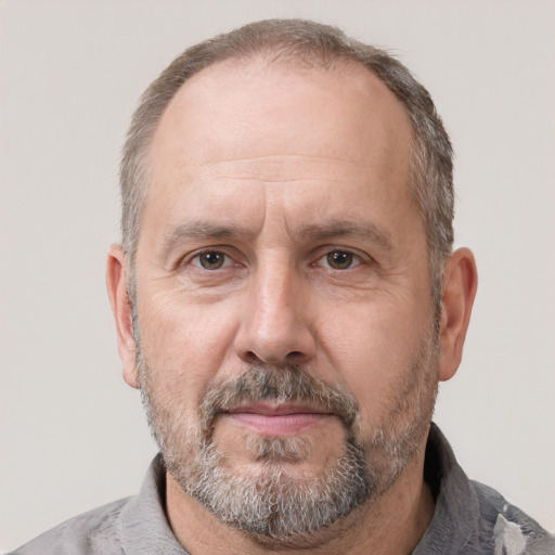 Joyful white middle-aged male with short  brown hair and brown eyes