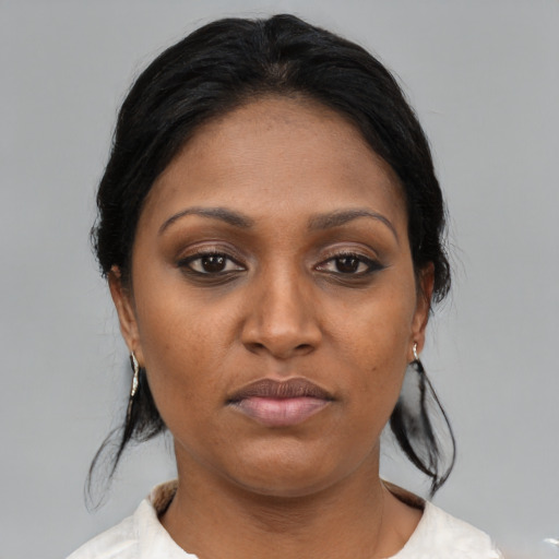 Joyful asian young-adult female with medium  black hair and brown eyes