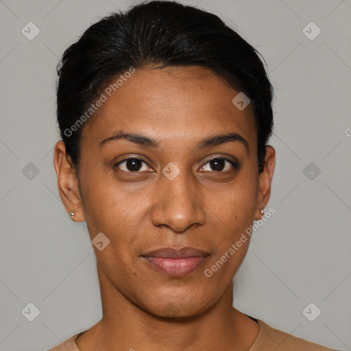 Joyful black young-adult female with short  black hair and brown eyes