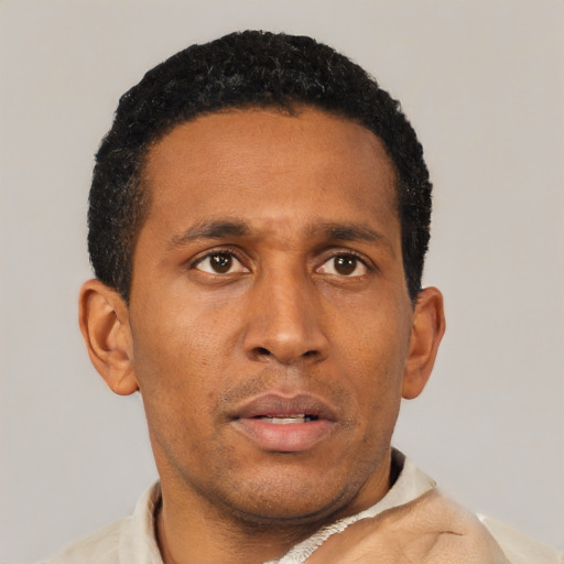 Neutral latino young-adult male with short  brown hair and brown eyes