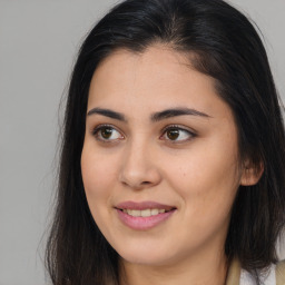 Joyful asian young-adult female with long  brown hair and brown eyes