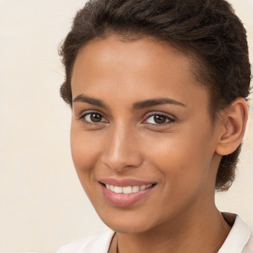 Joyful white young-adult female with short  brown hair and brown eyes