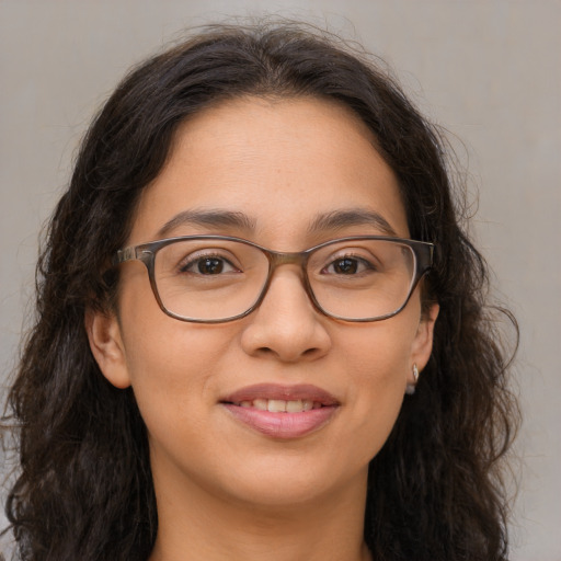 Joyful white adult female with long  brown hair and brown eyes