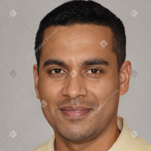 Joyful latino young-adult male with short  black hair and brown eyes