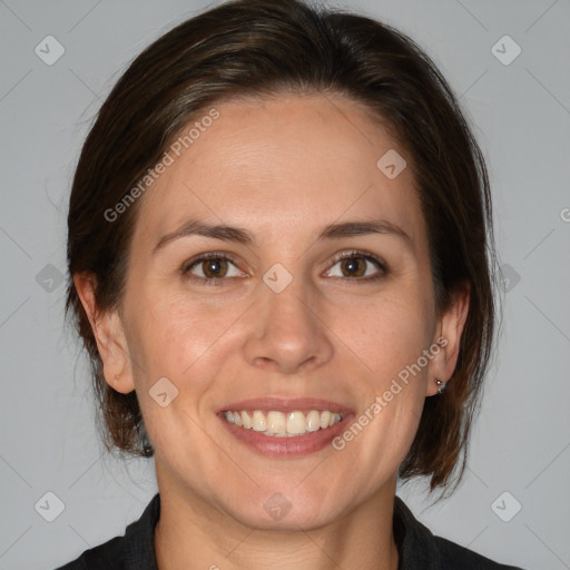 Joyful white adult female with medium  brown hair and brown eyes