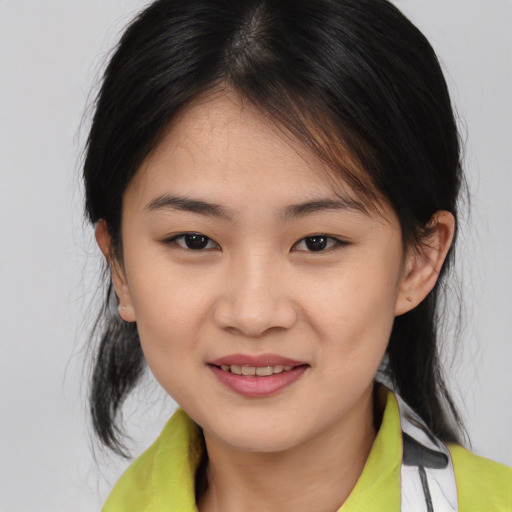Joyful asian young-adult female with medium  brown hair and brown eyes