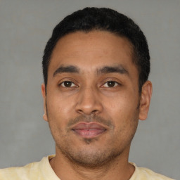Neutral latino young-adult male with short  black hair and brown eyes
