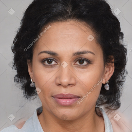 Joyful latino adult female with medium  brown hair and brown eyes