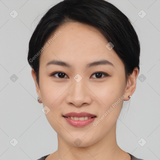 Joyful asian young-adult female with medium  black hair and brown eyes