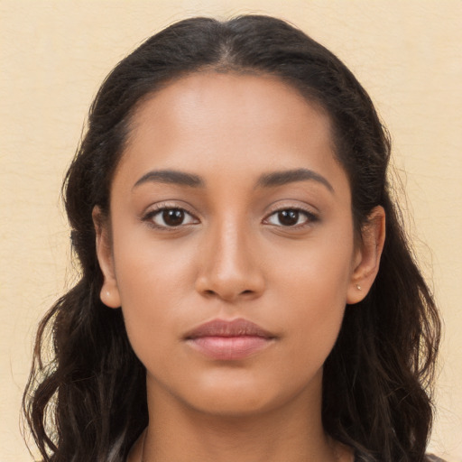 Neutral latino young-adult female with long  brown hair and brown eyes