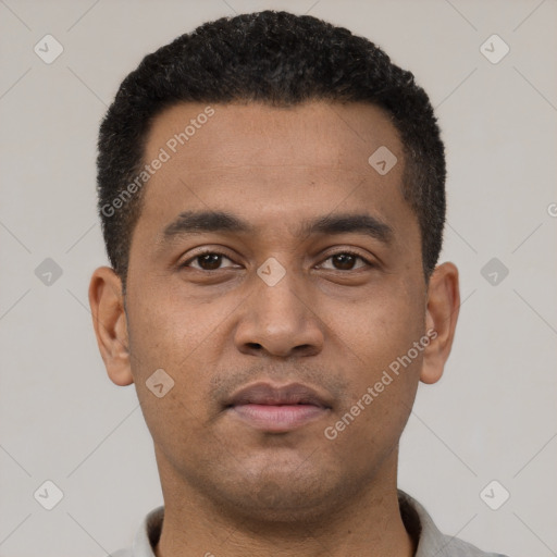 Neutral latino young-adult male with short  black hair and brown eyes