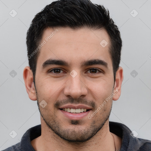 Joyful white young-adult male with short  black hair and brown eyes