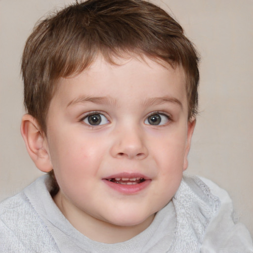 Joyful white child male with short  brown hair and brown eyes