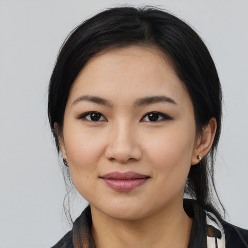 Joyful latino young-adult female with medium  black hair and brown eyes