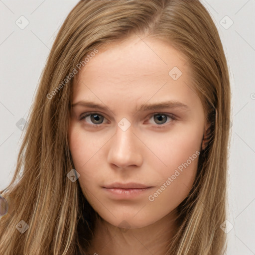 Neutral white young-adult female with long  brown hair and brown eyes