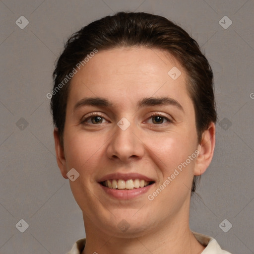 Joyful white young-adult female with short  brown hair and brown eyes