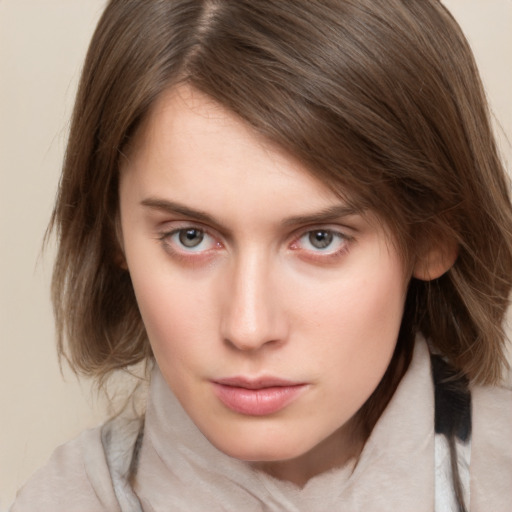 Neutral white young-adult female with medium  brown hair and grey eyes