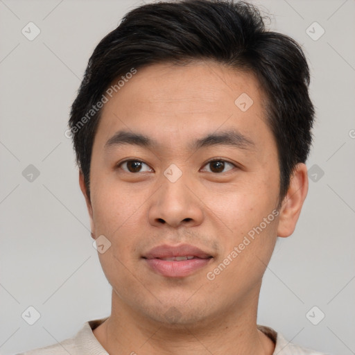 Joyful asian young-adult male with short  brown hair and brown eyes