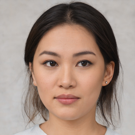 Neutral asian young-adult female with medium  brown hair and brown eyes