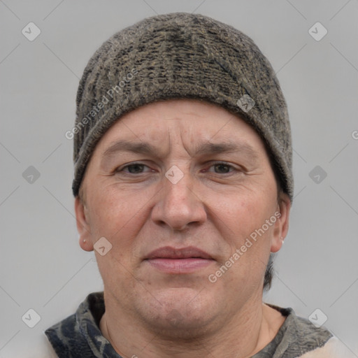 Joyful white adult male with short  brown hair and grey eyes