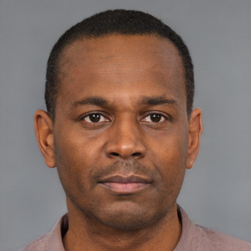Neutral black young-adult male with short  brown hair and brown eyes