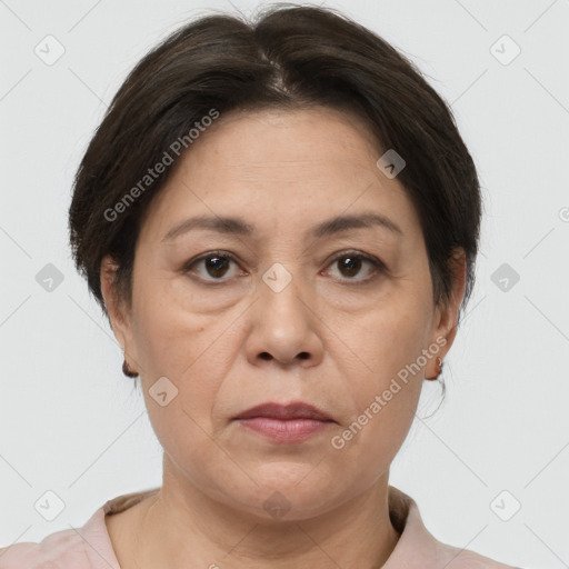 Joyful white adult female with short  brown hair and brown eyes