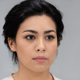 Neutral asian young-adult female with medium  brown hair and brown eyes