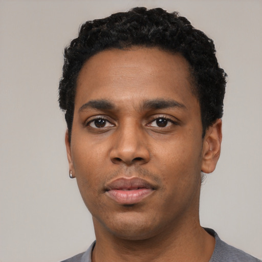Neutral black young-adult male with short  black hair and brown eyes