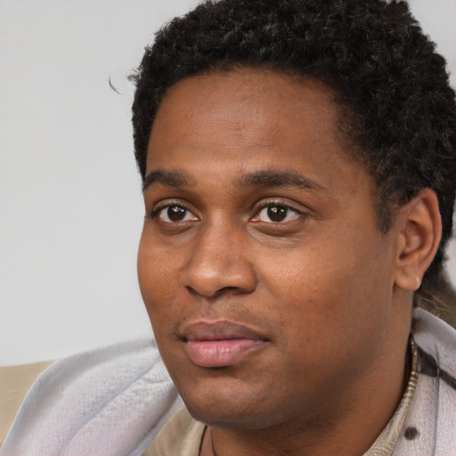 Neutral black young-adult male with short  black hair and brown eyes