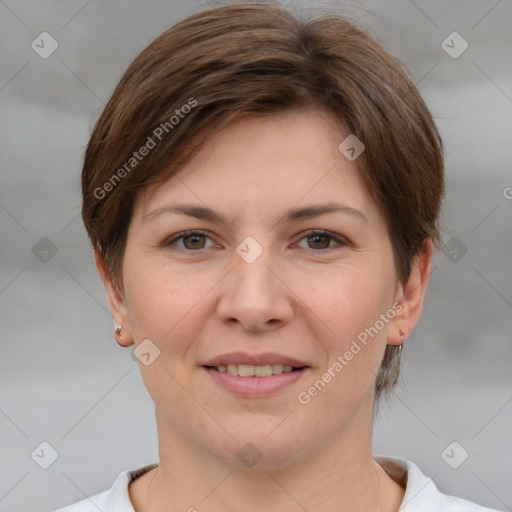 Joyful white young-adult female with short  brown hair and grey eyes