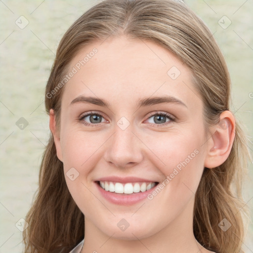 Joyful white young-adult female with medium  brown hair and blue eyes