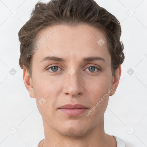 Joyful white young-adult female with short  brown hair and grey eyes