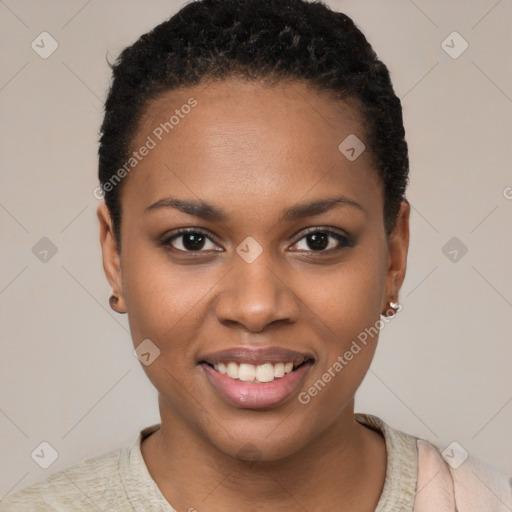 Joyful black young-adult female with short  black hair and brown eyes