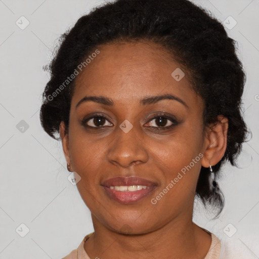 Joyful black young-adult female with short  brown hair and brown eyes