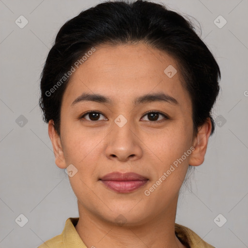 Joyful latino young-adult female with short  brown hair and brown eyes